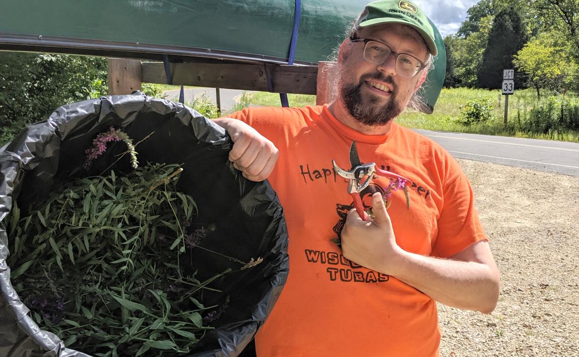 Wallrath after removing invasives on canoe trip