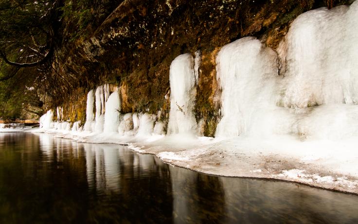 Ice on the rocky banks of a body of water